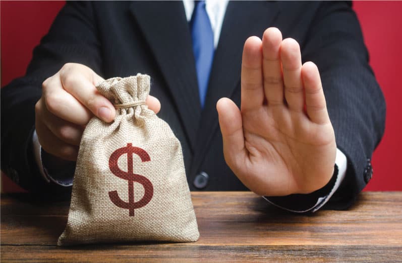 Transparent Pricing – No Hidden Fees Business person refusing money, symbolizing fair and transparent pricing